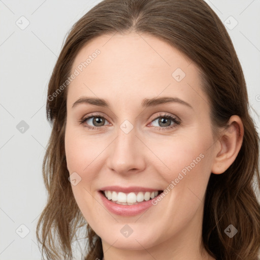 Joyful white young-adult female with long  brown hair and blue eyes