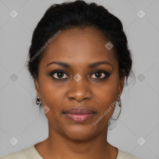 Joyful black young-adult female with short  black hair and brown eyes