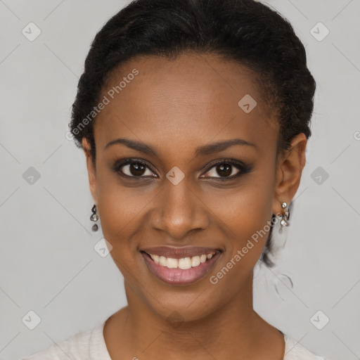 Joyful black young-adult female with short  black hair and brown eyes