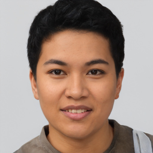 Joyful asian young-adult female with short  black hair and brown eyes