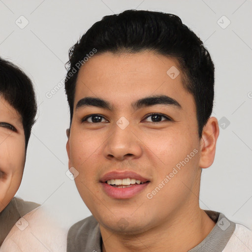 Joyful asian young-adult male with short  black hair and brown eyes