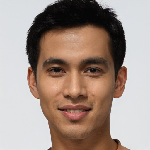 Joyful asian young-adult male with short  brown hair and brown eyes