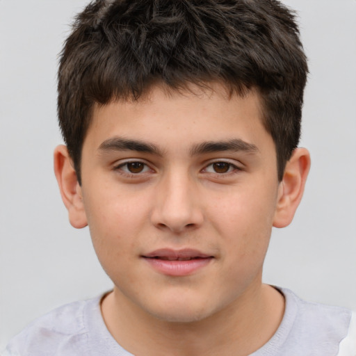 Joyful white child male with short  brown hair and brown eyes