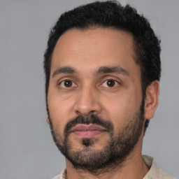 Neutral latino young-adult male with short  black hair and brown eyes