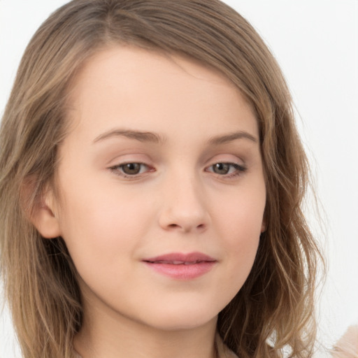 Joyful white child female with long  brown hair and brown eyes