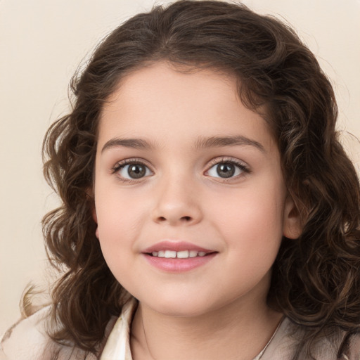 Joyful white child female with long  brown hair and brown eyes