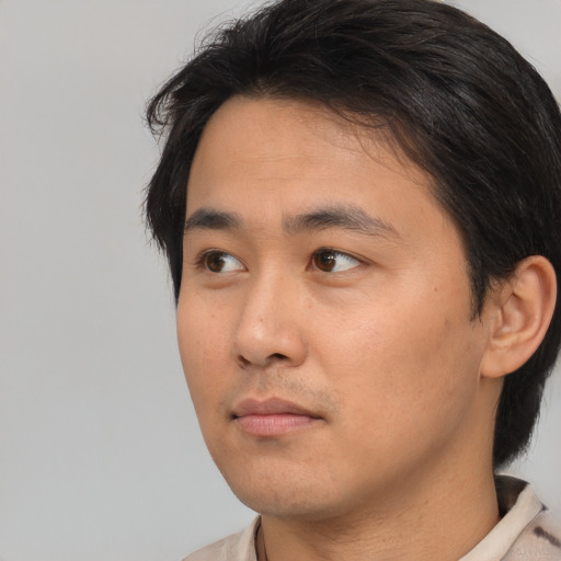 Neutral white young-adult male with medium  black hair and brown eyes