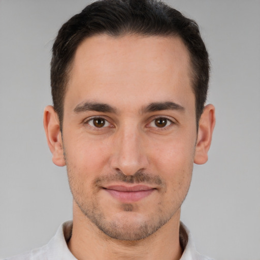 Joyful white young-adult male with short  brown hair and brown eyes