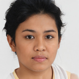 Neutral asian young-adult female with medium  brown hair and brown eyes