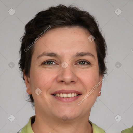 Joyful white adult female with short  brown hair and brown eyes