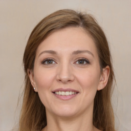 Joyful white young-adult female with long  brown hair and grey eyes