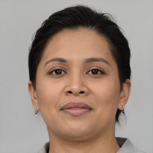 Joyful asian adult female with short  brown hair and brown eyes