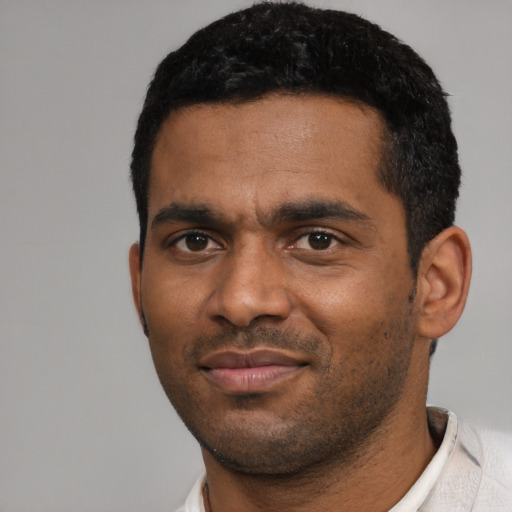 Neutral black young-adult male with short  black hair and brown eyes
