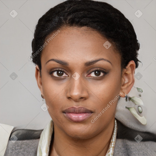 Joyful black young-adult female with short  black hair and brown eyes