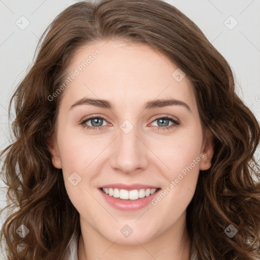 Joyful white young-adult female with long  brown hair and green eyes