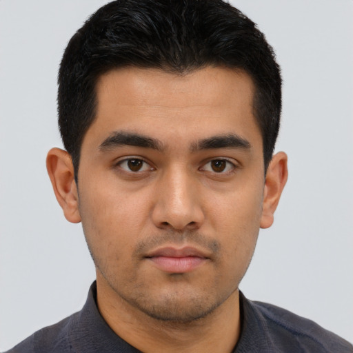 Neutral latino young-adult male with short  brown hair and brown eyes