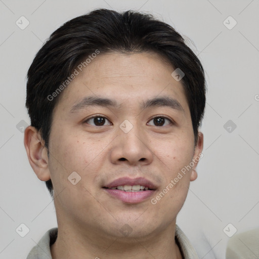 Joyful asian young-adult male with short  brown hair and brown eyes