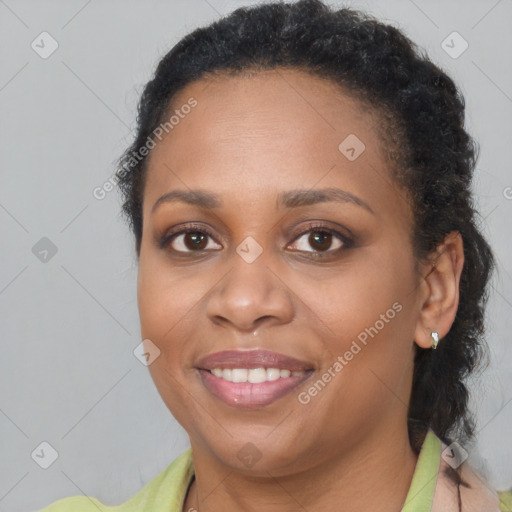 Joyful black young-adult female with medium  brown hair and brown eyes