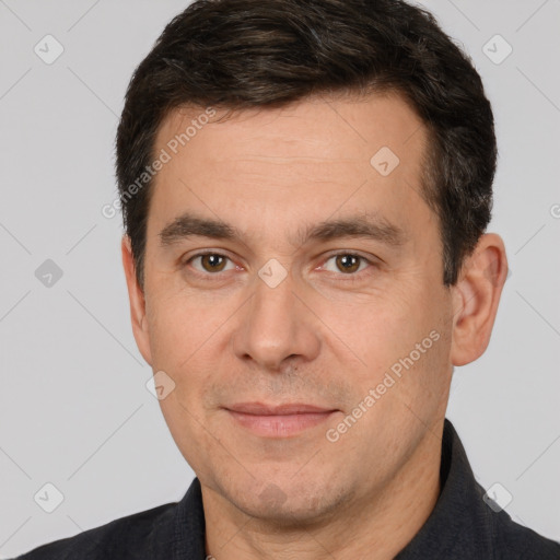 Joyful white adult male with short  brown hair and brown eyes