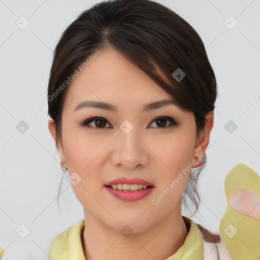 Joyful asian young-adult female with medium  brown hair and brown eyes