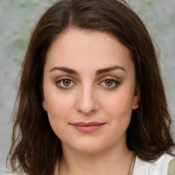 Joyful white young-adult female with medium  brown hair and green eyes