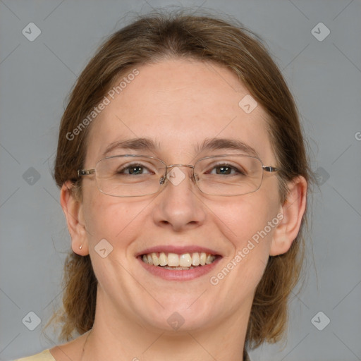 Joyful white adult female with medium  brown hair and blue eyes