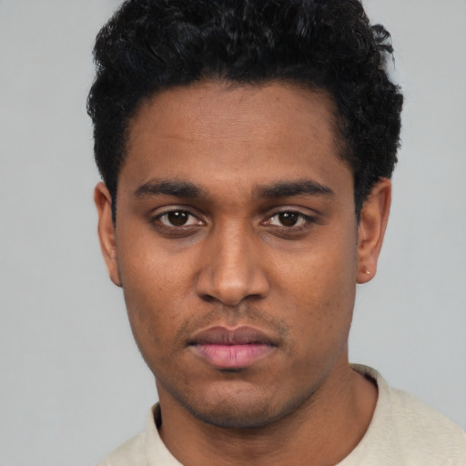 Neutral black young-adult male with short  black hair and brown eyes