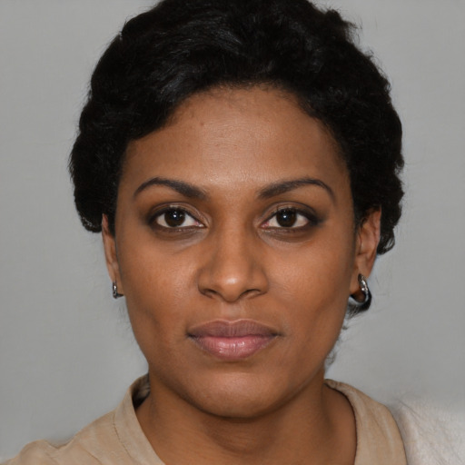 Neutral black young-adult female with short  black hair and brown eyes