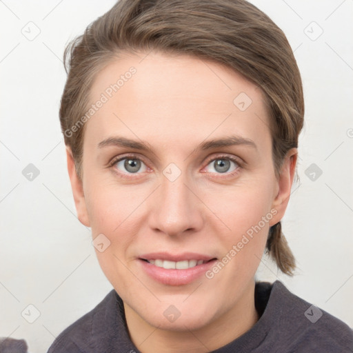 Joyful white young-adult female with short  brown hair and grey eyes