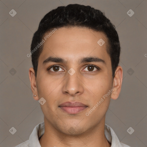 Joyful latino young-adult male with short  brown hair and brown eyes