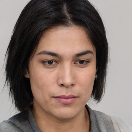 Neutral asian young-adult female with medium  brown hair and brown eyes