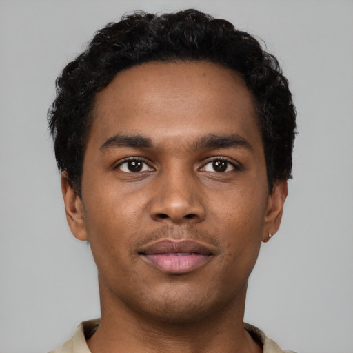 Neutral black young-adult male with short  black hair and brown eyes