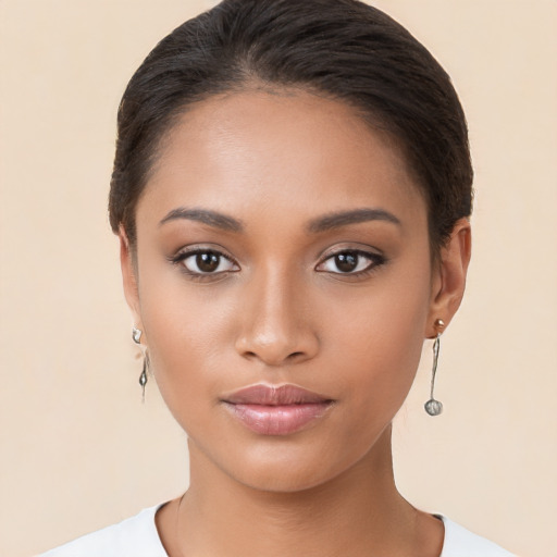 Joyful latino young-adult female with short  brown hair and brown eyes