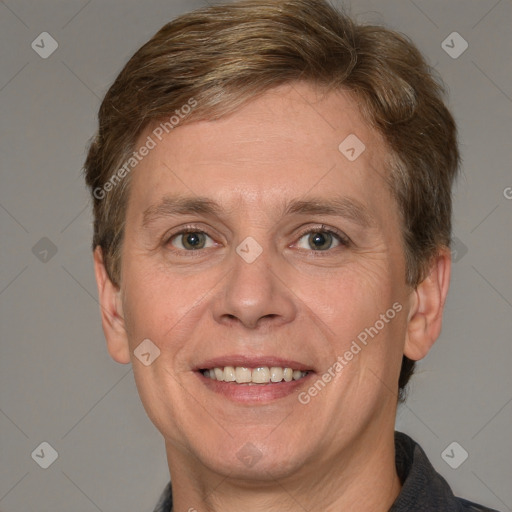 Joyful white adult male with short  brown hair and grey eyes