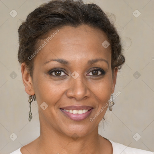 Joyful black adult female with short  brown hair and brown eyes