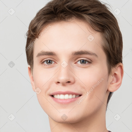 Joyful white young-adult female with short  brown hair and grey eyes