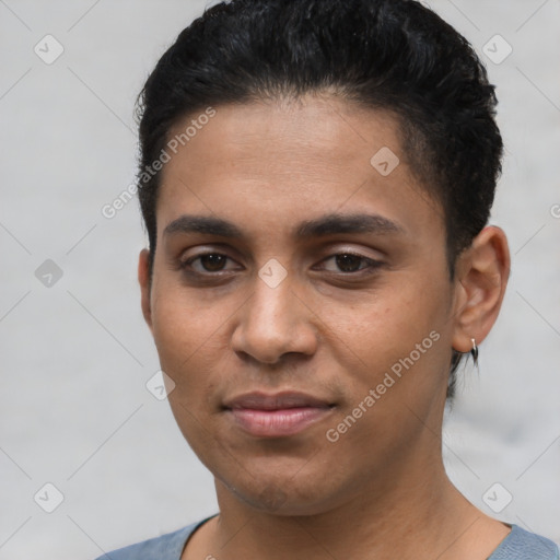 Joyful latino young-adult male with short  black hair and brown eyes