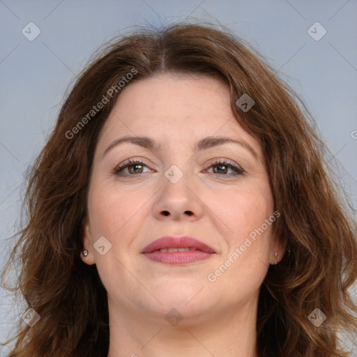 Joyful white adult female with long  brown hair and brown eyes