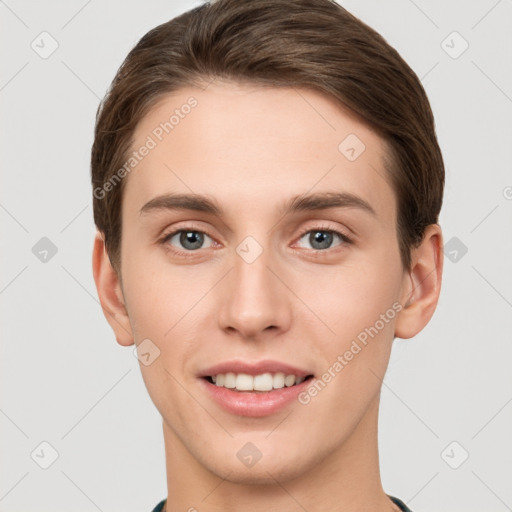 Joyful white young-adult female with short  brown hair and grey eyes