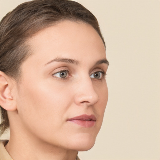 Neutral white young-adult female with short  brown hair and brown eyes