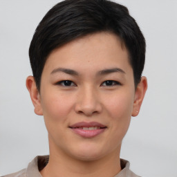 Joyful asian young-adult female with short  brown hair and brown eyes