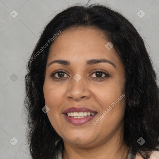 Joyful latino young-adult female with long  black hair and brown eyes