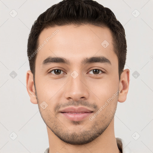 Joyful white young-adult male with short  brown hair and brown eyes