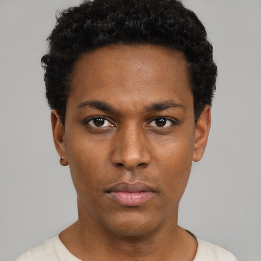 Neutral black young-adult male with short  black hair and brown eyes