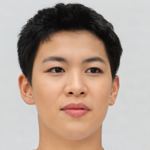 Joyful asian young-adult female with short  brown hair and brown eyes