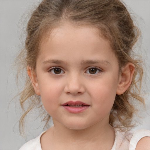 Joyful white child female with medium  brown hair and brown eyes