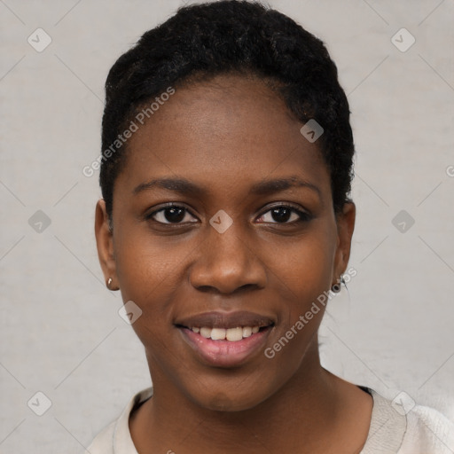 Joyful black young-adult female with short  black hair and brown eyes