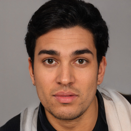 Neutral latino young-adult male with short  black hair and brown eyes