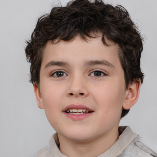 Joyful white child male with short  brown hair and brown eyes