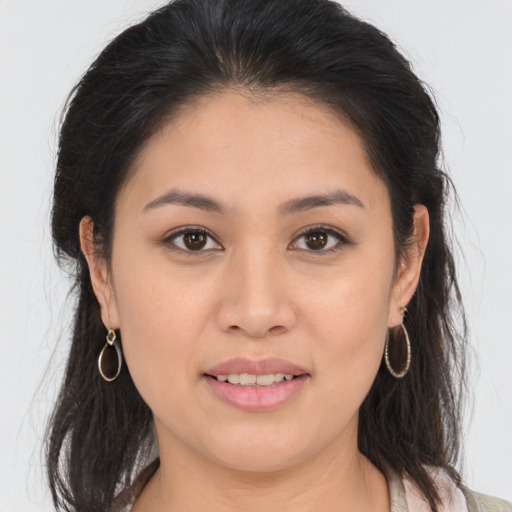 Joyful asian young-adult female with medium  brown hair and brown eyes